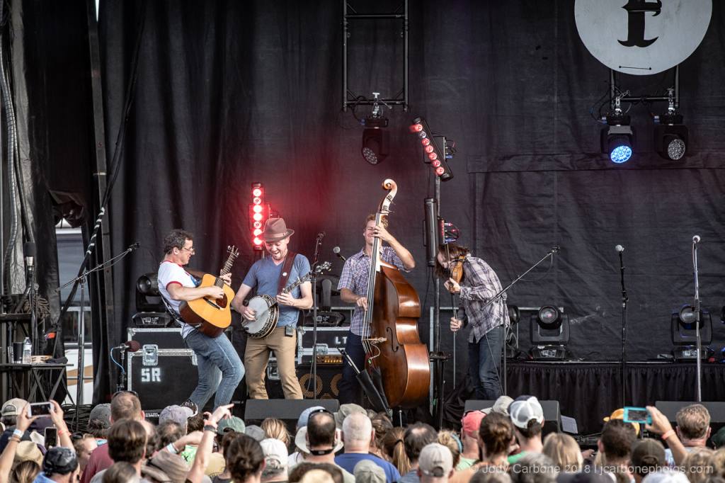 The Infamous Stringdusters playing onstage in front of an audience