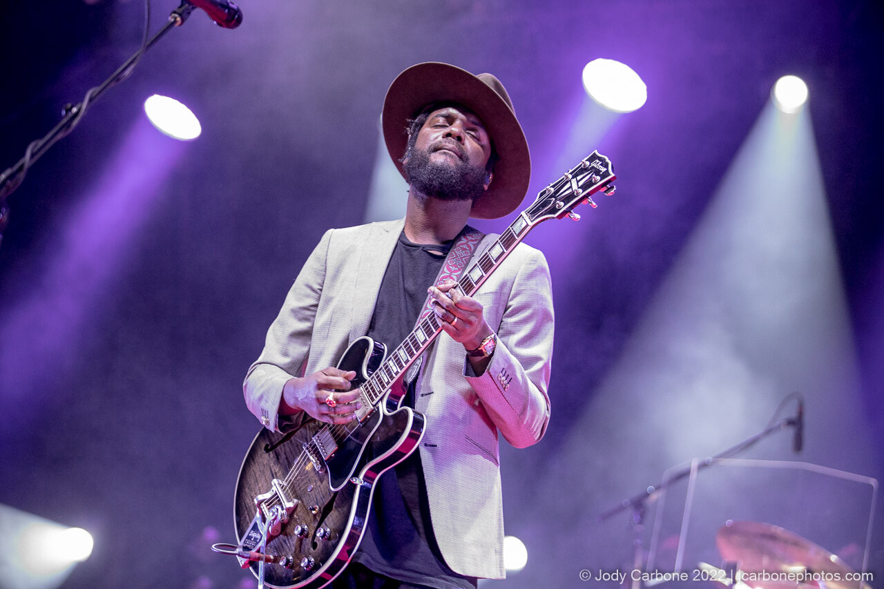 Gary Clark Jr. looks to the sky while he plays an electric Gibson guitar