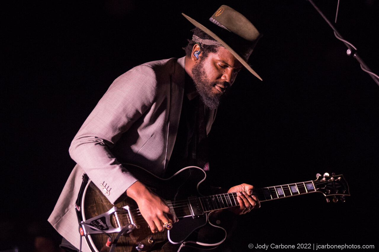 Gary Clark Jr. in moody lights with thoughtful look