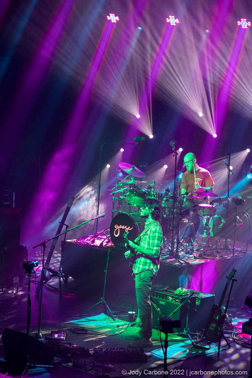 Pretty lights concert photography - Rick on guitar in the foreground, Ben Atkin playing drums on riser